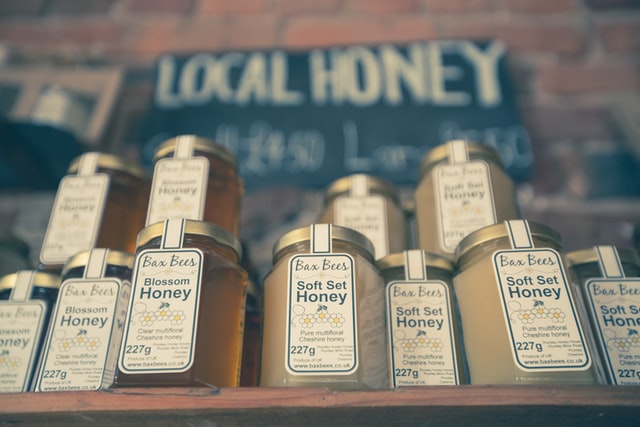 Local honey pots on shelve